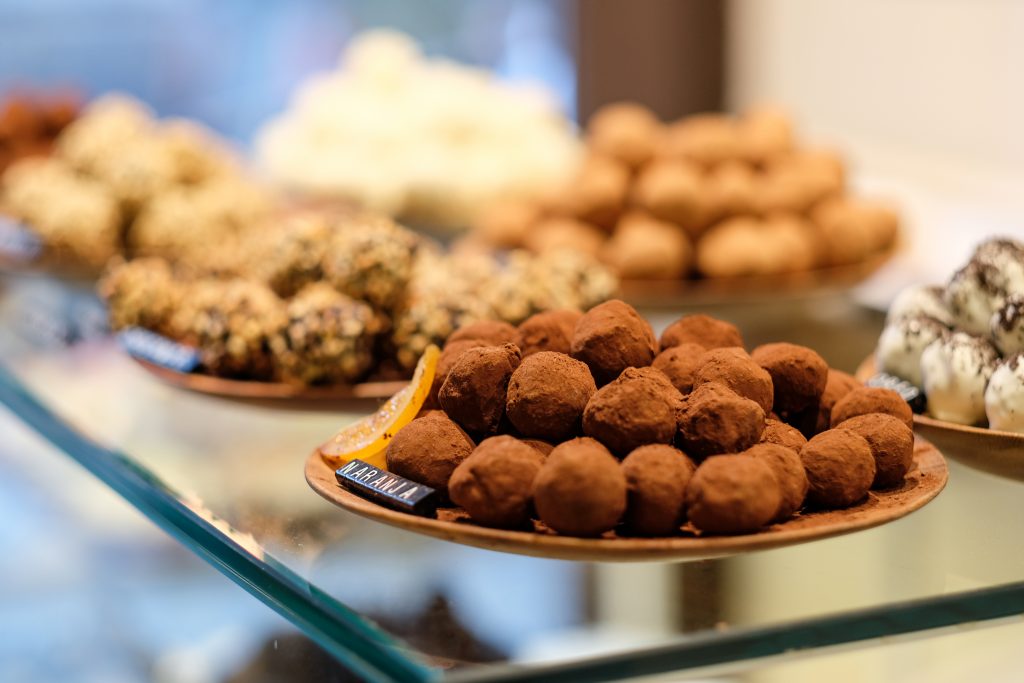 Chocolate truffle candies in confectionery store