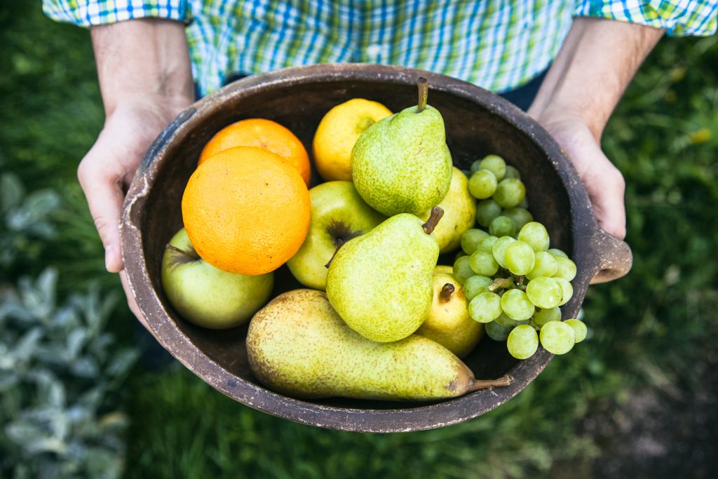 Fresh fruit. Farmer with bowl of fruit.s. Fruit basket.