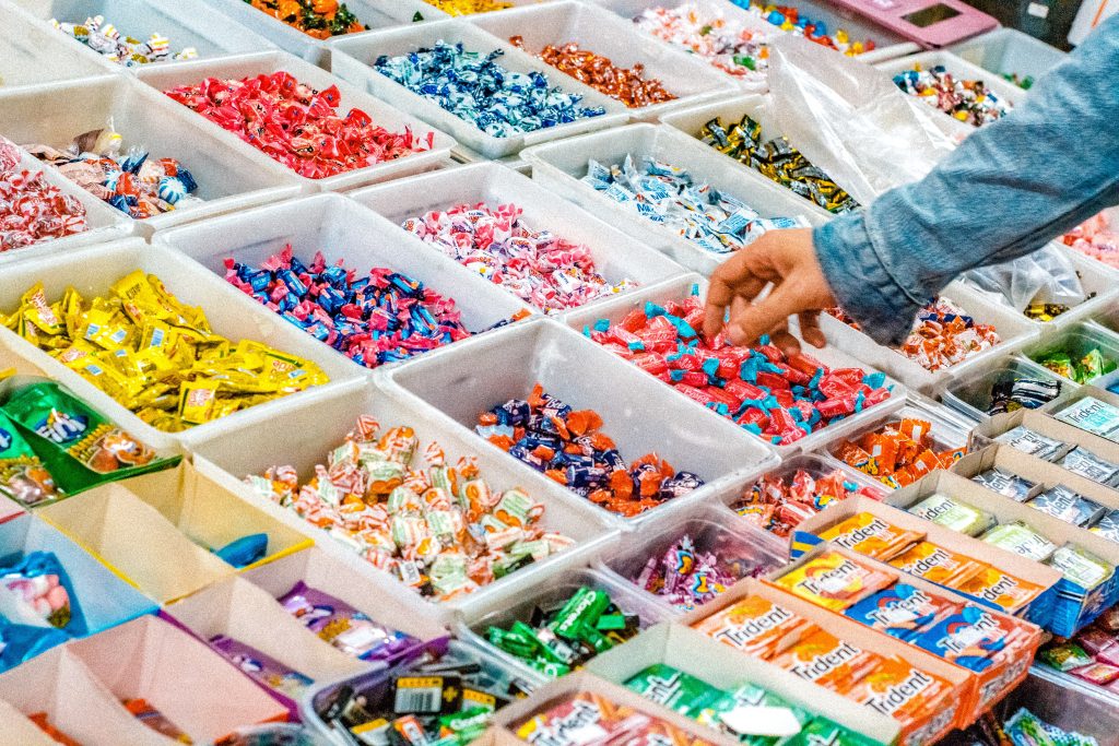 Person reaching for candy.