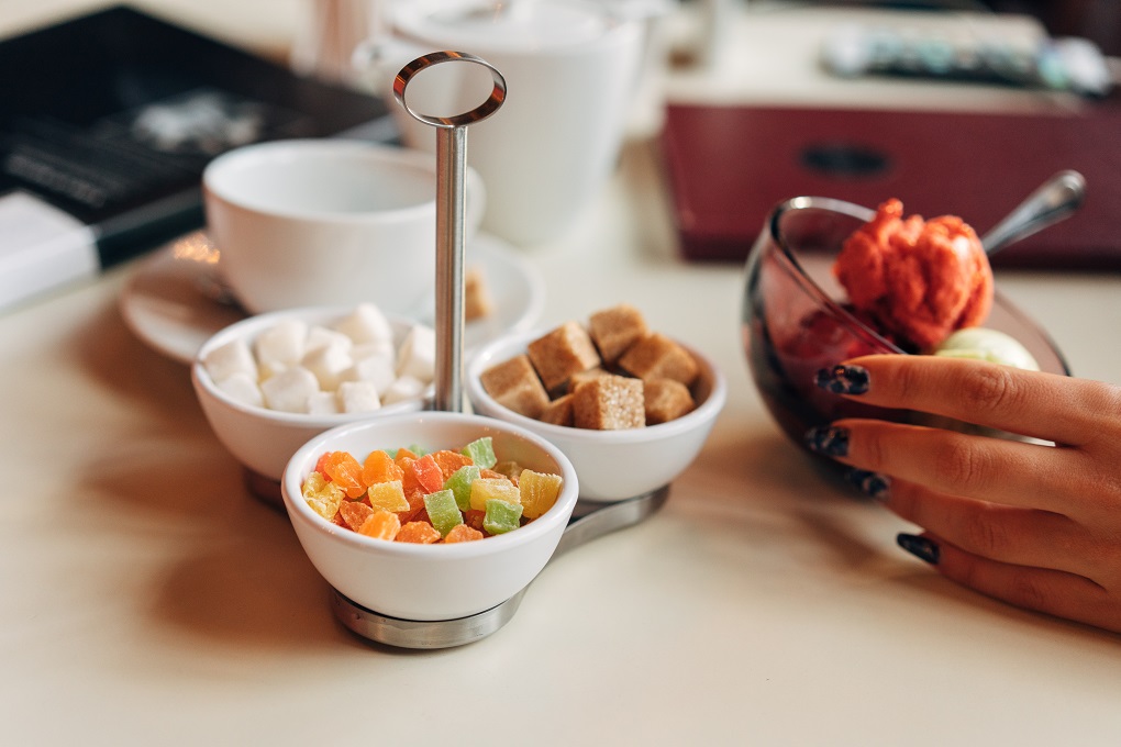 Different sugar lies on the stand on the table