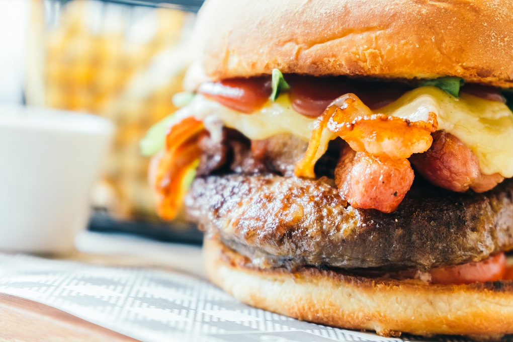 Soft focus point on Beef Hamburger with bacon and cheese - Unhealthy food style and Filter Effect
