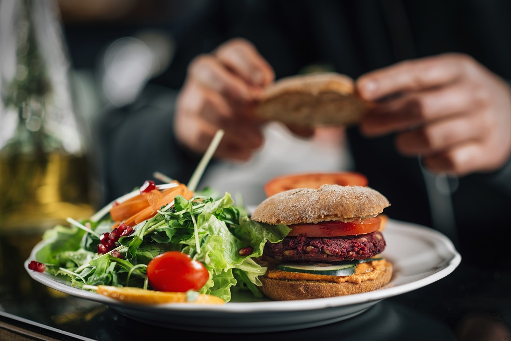Chef making healthy vegetarian burgers, close up.