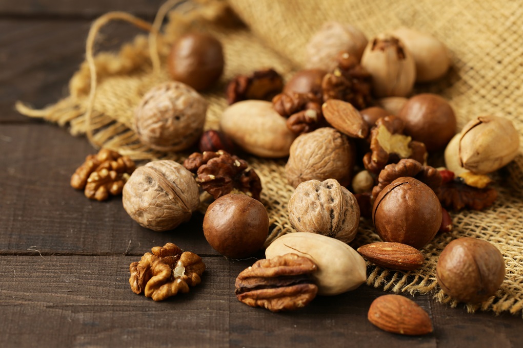 nuts mix on wooden background, healthy food